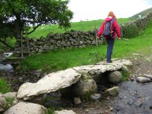 Walker crossing clapper bridge near Dufton Pike © NPAP/Elizabeth Pickett Walker crossing clapper bridge near Dufton Pike © NPAP/Elizabeth Pickett